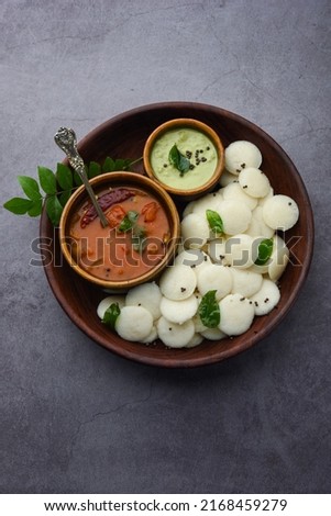 Mini idli is the smaller version of soft and spongy round shaped steamed regular rice idli, also known as button and cocktail idly