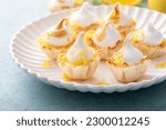 Mini lemon meringue tarts filled with lemon curd, one bite desserts idea