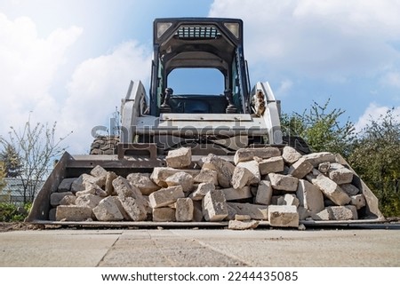 Mini loader on wheels during heavy construction work. Zdjęcia stock © 
