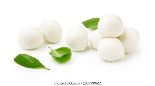 Mini Mozaarella cheese balls with fresh basil leaves isolated on white background. Heap of Mozzarella cheese.