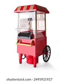 Mini old-style popcorn machine isolated on white background with clipping path