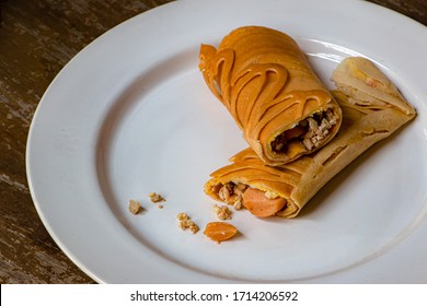 Mini Pancake Roll Stuffed With Pork And Sausage On White Dish. 