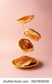 mini pancakes with jam flying food selective focus