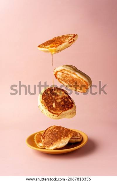 mini\
pancakes with jam flying food selective\
focus