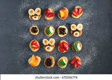 Mini Pancakes With Strawberry, Banana, Avocado, Peach And Blueberry From Above