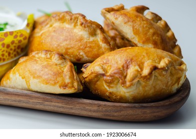 Mini pasties with sour cream, succulent pork, turkey, bacon and cranberry all wrapped in shortcrust pastry, tasty food