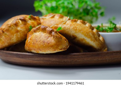 Mini pasties with tomato sauce, succulent pork, turkey, bacon and cranberry all wrapped in shortcrust pastry, tasty food - Shutterstock ID 1941179461