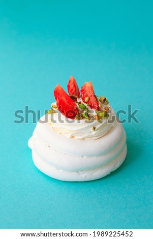 Mini Pavlova Cake meringue dessert with crisp crust and soft inside. Meringue dessert Pavlova cake with fresh strawberries. Summer dessert. French cake. Confectionery. Classic dessert