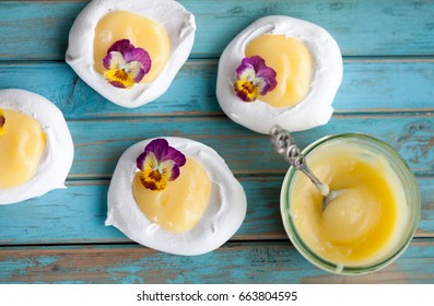 Mini Pavlova With Lemon Curd And Flowers