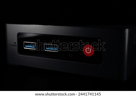 Mini PC. Great computer to use as a HTPC to play games and watch TV shows and movies. Close-up of the front, where USB ports can be seen. High quality 4k footage