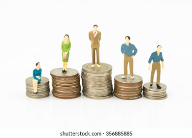 Mini People (people Model) On Coin With White Background,business Concept