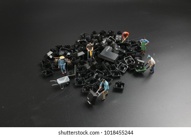 a mini people Work on Computer Key board