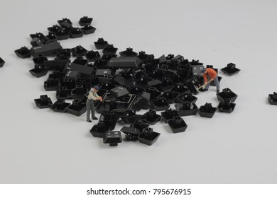 the mini  people Work on Computer Key board