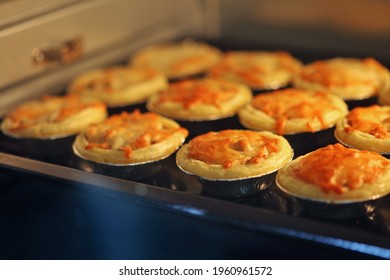 Mini Pie From Meat And Mushrooms Baking In Industrial Oven, Pie And Pastry Wholesale Bakery Factory