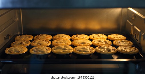 Mini Pie From Meat And Mushrooms Baking In Industrial Oven, Pie And Pastry Wholesale Bakery Factory