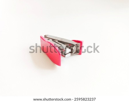Mini pink stepler isolated on white background. 