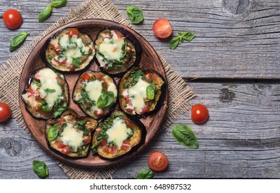 Mini Pizza With Eggplant , Tomato And Basil .