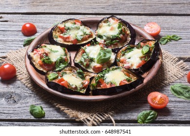 Mini Pizza With Eggplant , Tomato And Basil .