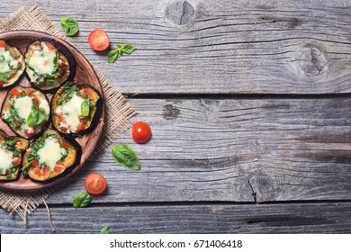 Mini Pizza With Eggplant , Tomato And Basil . Top View With Space For Text