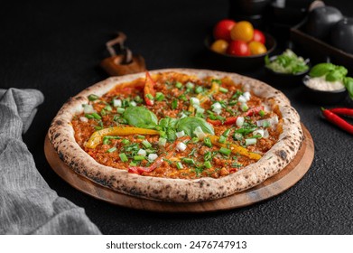 A mini pizza on wooden platter with assorted toppings - Powered by Shutterstock