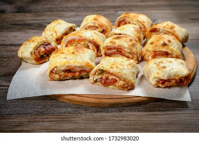 Mini Pizza Rolls On Wooden Board