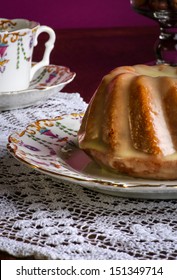 Mini Pound Cake - Almond Lemon Drizzle Cake On Old Pictures Coffee Cup, Side Plate On Lace And Glass Cup Full Of Almonds And Hazelnuts, Purple Background