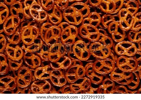 Mini pretzels background textured pattern. Backdrop filled with Baked twists