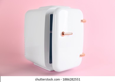 Mini Refrigerator For Cosmetics On Pink Background