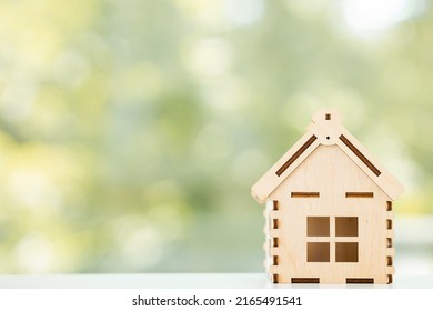 Mini residential craft house on a green summer background