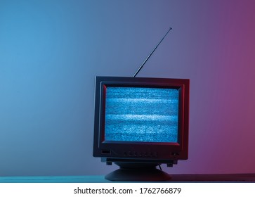 Mini Retro Tv Antenna Receiver. Old Fashioned TV Set. Pink Blue Gradient Neon Light. Television Noise, No Signal. 80s Retro Wave