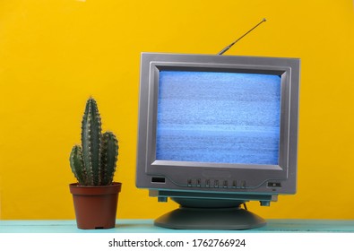 Mini Retro Tv Antenna Receiver On Yellow Background. Old Fashioned TV Set With Cactus. Television Noise, No Signal. 80s