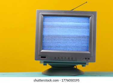 Mini Retro Tv Antenna Receiver On Yellow Background. Old Fashioned TV Set. Television Noise, No Signal. 80s