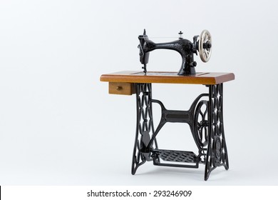 Mini Sewing Machine On White Background