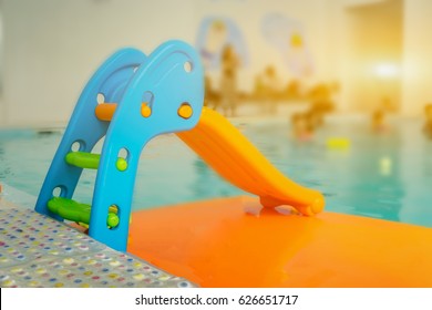 Mini Slider For Kid By The Swimming Pool,selective Focus,vintage Color