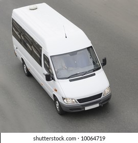 Mini Small Passenger Tour Van Bus On Road Isolated