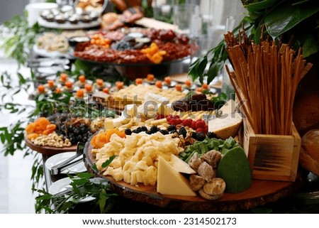 Mini snacks on a white background. Snacks for public catering. Buffet table. A treat for a buffet or a house party. The table is reserved for catering.