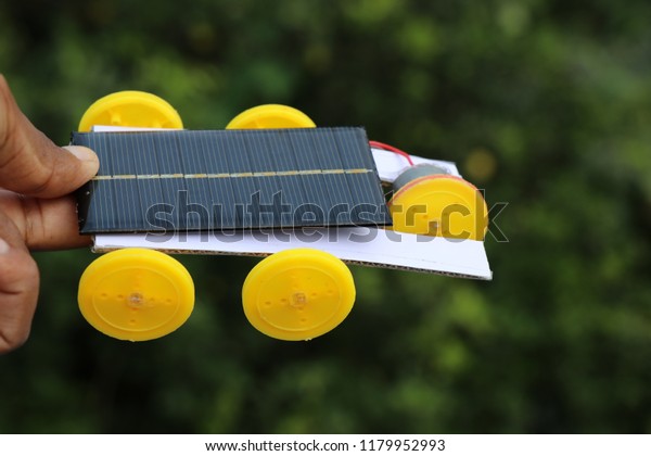mini solar powered car working model,mini solar cell is\
used to power the direct current motor this unique mini solar car\
has 5 wheels and it works on green energy because of usage of the\
solar panel 