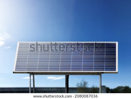 Mini solarcell panel with bluesky background, concept for using natural power from the sunlight in daily life everyday, soft and selective focus.