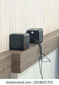 mini speaker on side the wall