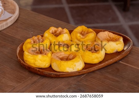 Mini sponge cakes (pão de ló) displayed on a buffet, soft and fluffy Portuguese desserts perfect for parties and sweet treats.