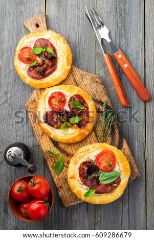 Similar – Puff pastry tarts with nectarines, camembert and thyme