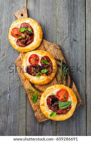 Similar – Puff pastry tarts with nectarines, camembert and thyme