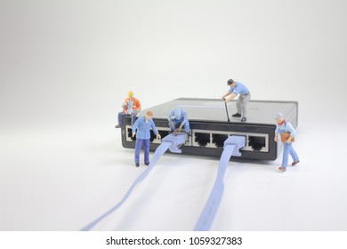 a mini Technicians connecting network of cable