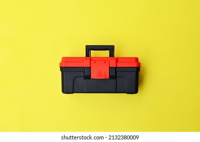 Mini tool box top view isolated on yellow background. 