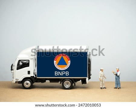 Mini toy of action figure at table with blurred background. BNPB ( BADAN NASIONAL PENAGGULANGAN BENCANA ) REPUBLIK INDONESIA