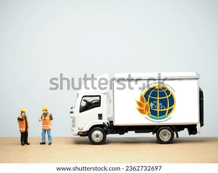 Mini toy at table with blurred background. Kementerian Agraria dan Tata Ruang Badan Pertanahan Nasional (disingkat ATRBPN) logo design.
