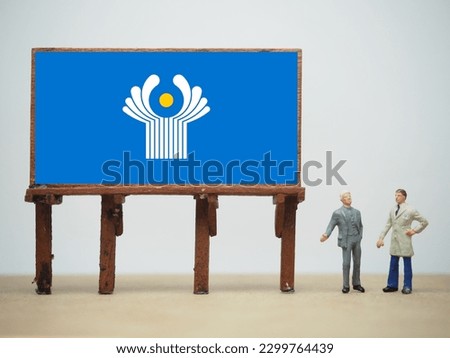 Mini toy at table. The Commonwealth of Independent States (CIS) flag, is a regional intergovernmental organization in Eurasia. It was formed following the dissolution of the Soviet Union in 1991.