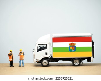 Mini toy at table. Industrial shipping concept. La Rioja flag design, is an autonomous community and province in Spain, in the north of the Iberian Peninsula. Its capital is Logroño. - Shutterstock ID 2253925821