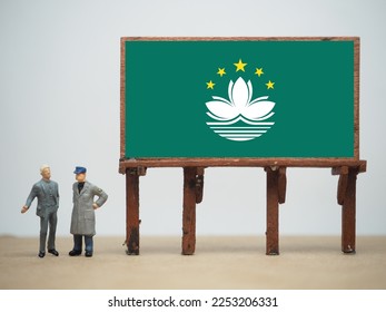 Mini toy at table with white background. Macau flag design. Macau or Macao officially the Macao Special Administrative Region of the People's Republic of China (MSAR).