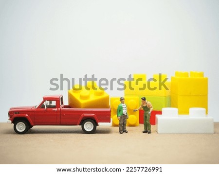 Mini toy at table with white background. Industrial concept.